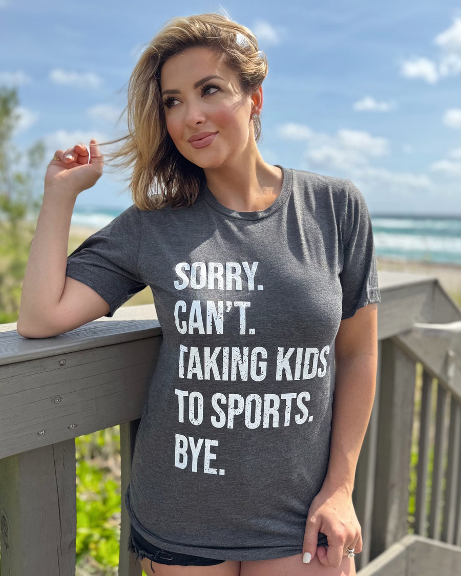 Sorry. Can’t. Taking Kids To Sports. Bye. Unisex Dark Gray Super Soft Tee